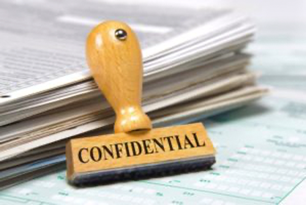 A rubber stamp with the word confidential on it.